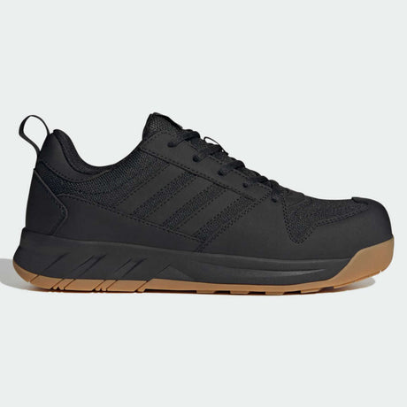 Der adidas MOTIX Low S1PS ESD-Sicherheitsschuh in Schwarz/Natur, hier im Profil abgebildet, verfügt über eine Gummisohle, Seitenstreifen und eine Fersenschlaufe – speziell entwickelt für maximalen Komfort und Schutz.